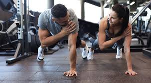 Toning Bingo Wings: Your Ultimate Guide to Sculpting Sleek Arms at the Gym 3 Fitness trainer demonstrating arm toning exercises Wealdstone