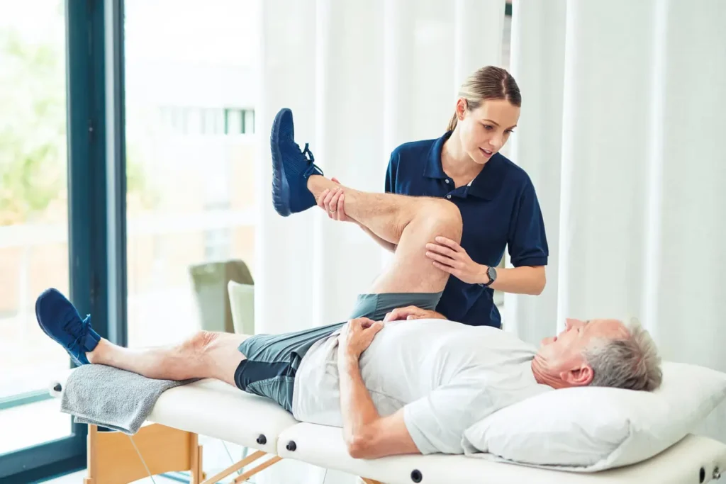 Revitalising Recovery: Effective Rehabilitation Strategies for Muscle Injuries 3 Physiotherapist assisting a patient with muscle recovery exercises Wealdstone