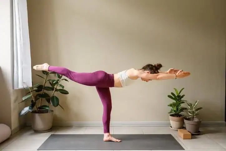 Achieving the Perfect Tone: How Often Should You Exercise for Results? 1 Woman doing Yoga exercise Wealdstone to help with toning the body.